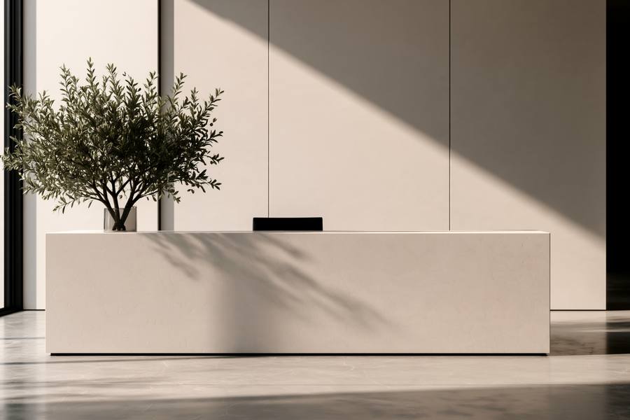 Stone reception desk with an olive tree